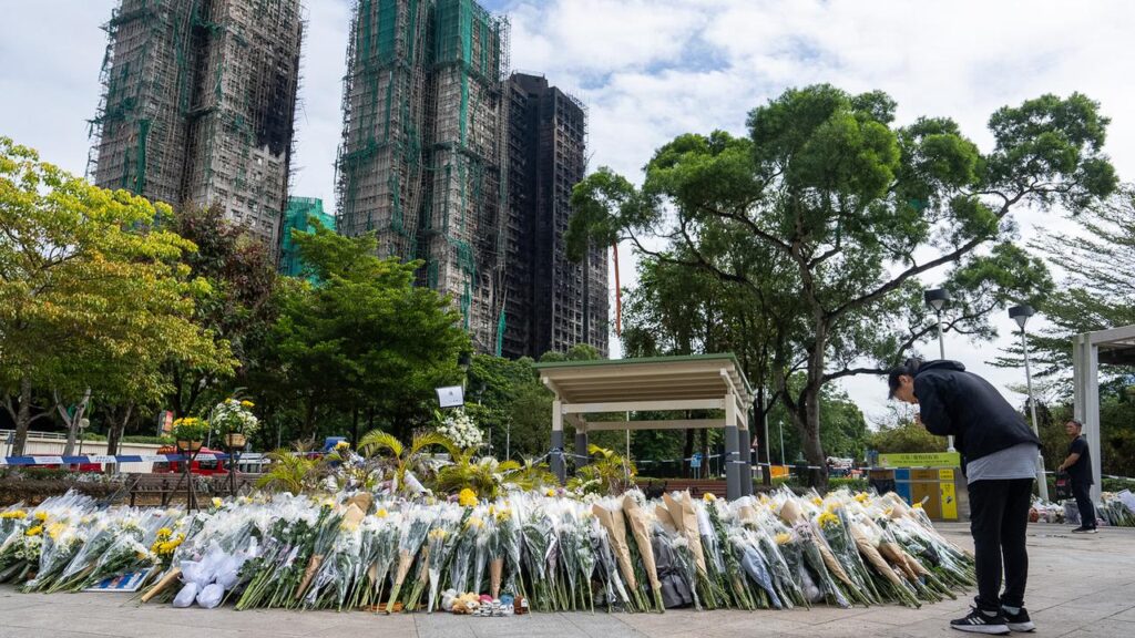 Thousands of people have turned out to pay tribute to victims of the apartment fire in Hong Kong.
