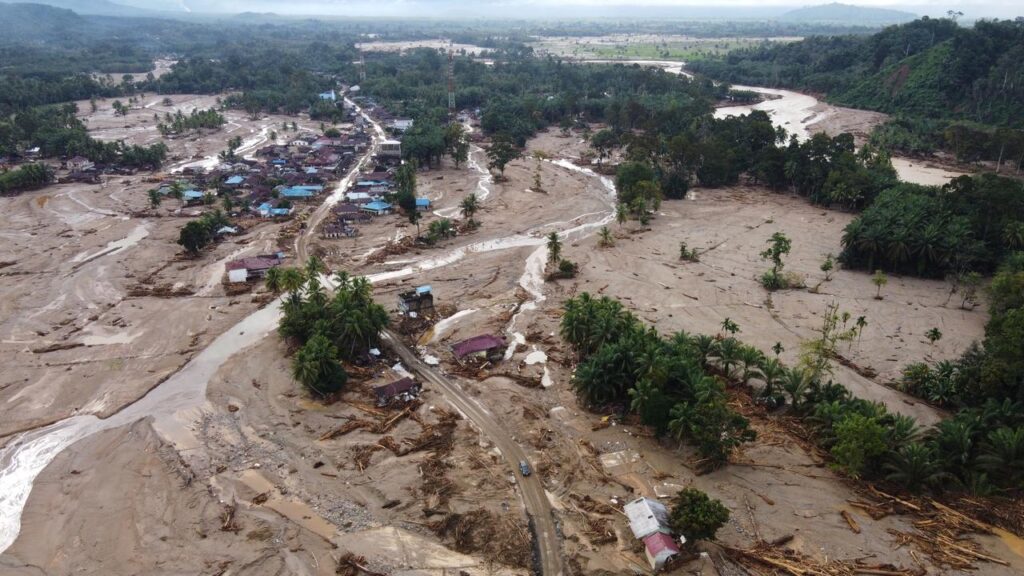 Rescuers are struggling to access villages in Sumatra island after devastating floods.
