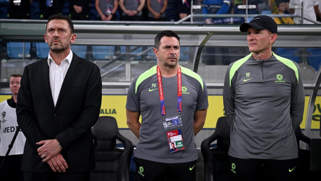Socceroos head coach Tony Popovic (l) and his team will soon know their opposition in the World Cup.
