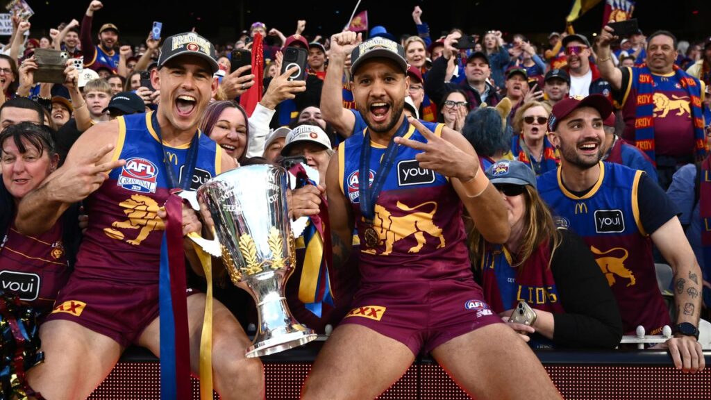 Premiership winner Callum Ah Chee (R) has discussed his messy move move from Brisbane to Adelaide.
