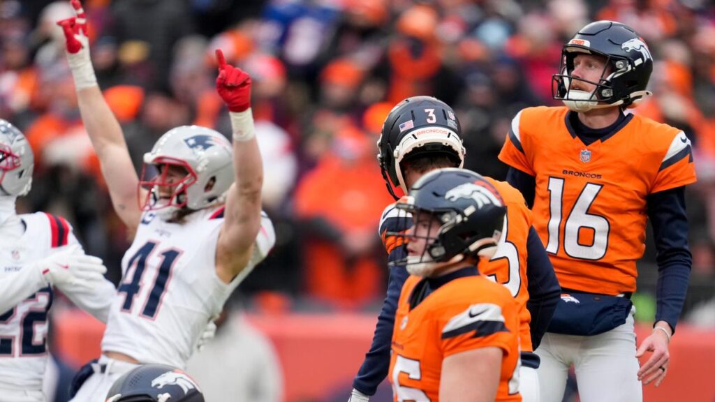 Denver’s Australian punter Jeremy Crawshaw (16) watches a missed field goal against the Patriots.
