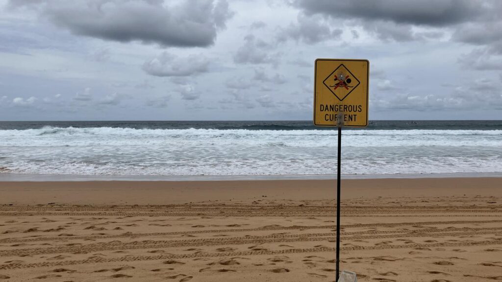 A teen has not been found after the dinghy he was in capsized near a headland on New Year’s Eve.
