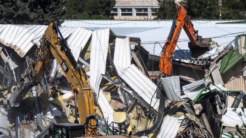 Bulldozers are demolishing the headquarters of the UN Relief and Works Agency in East Jerusalem.
