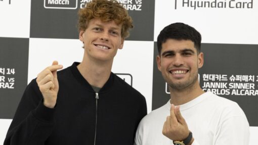 Tennis players Alcaraz and Sinner hold