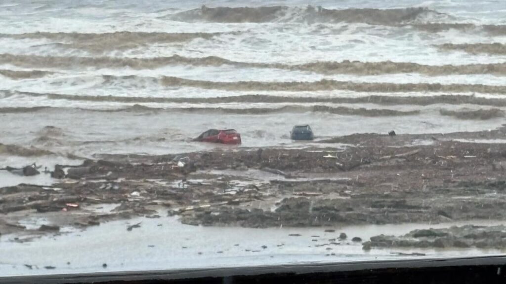 Flash flooding has swept cars out to sea in a popular tourist area southwest of Melbourne.
