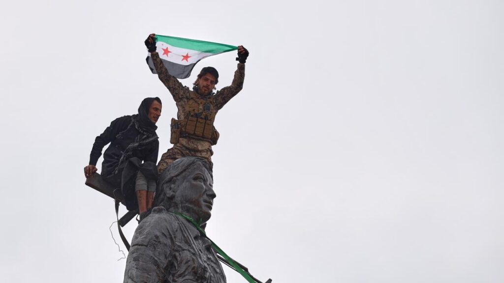 Syrian government soldiers celebrated after taking back a town from US-backed Kurdish forces.
