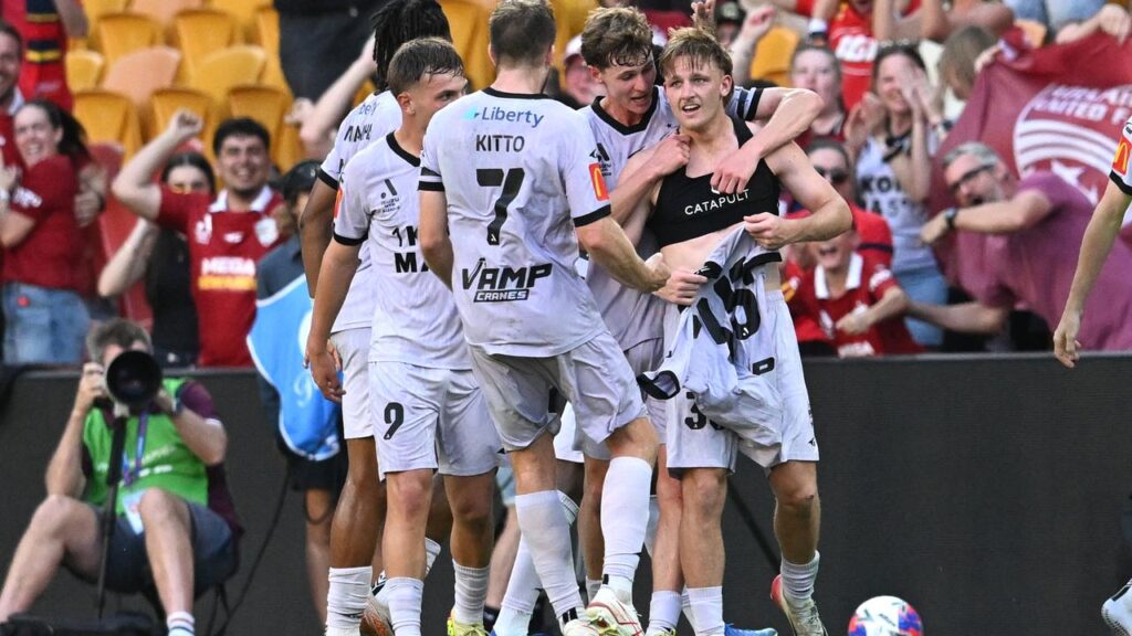 Hat-trick heroics by Brody Burkitt (right) earned Adelaide United a stunning win over Brisbane. 

