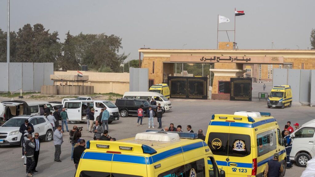 Ambulances waited at the Egyptian border before taking patients out of the Gaza Strip.
