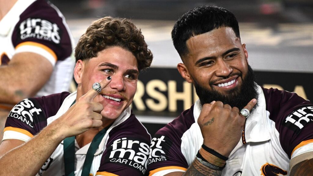 Reece Walsh and Payne Haas celebrate Brisbane’s 2025 NRL premiership.
