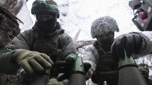 Ukrainian servicemen hold position