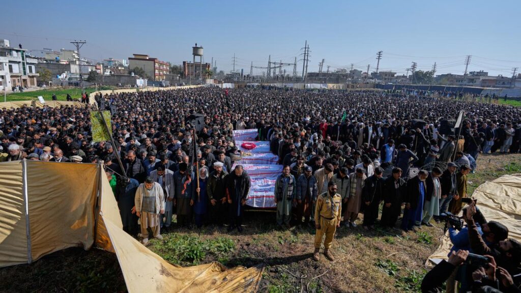 Thousands gathered to mourn the victims of a suicide bombing at a Shi’ite mosque in Pakistan.
