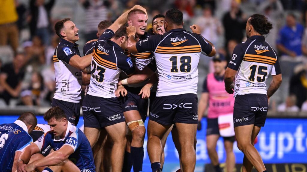 The Brumbies have squeaked home against the Blues to remain perfect to start their season.
