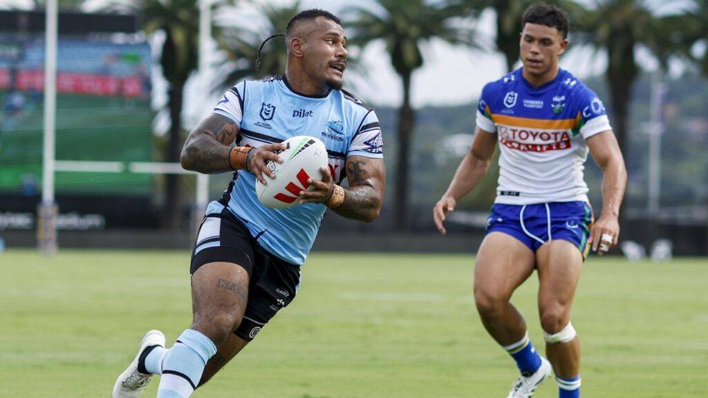 Cronulla’s Sione Katoa (l) scored but also picked up an injury in the trial win over Canberra.
