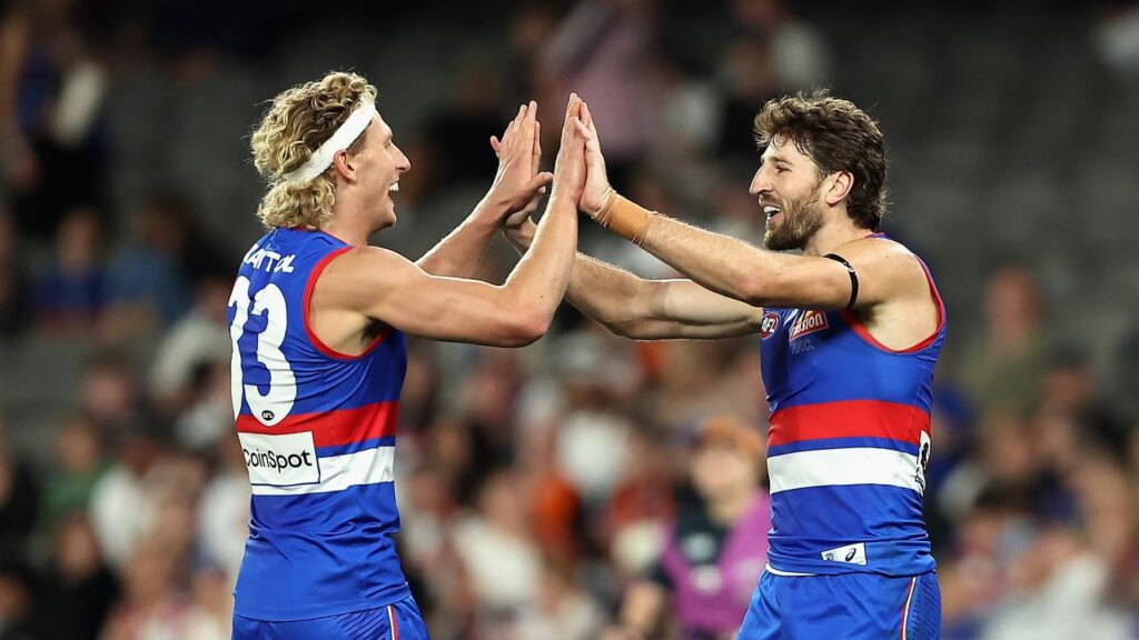 Marcus Bontempelli (r) and Aaron Naughton kicked nine goals between them as the Bulldogs routed GWS
