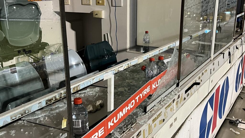 The shattered coaches’ box window at GIO Stadium which left Cameron Ciraldo with a hand injury.
