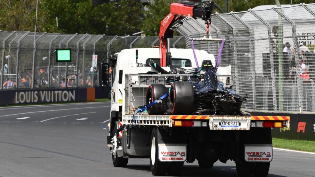 The damaged car of Mercedes’ Kimi Antonelli is towed from the track after the crash in practice.
