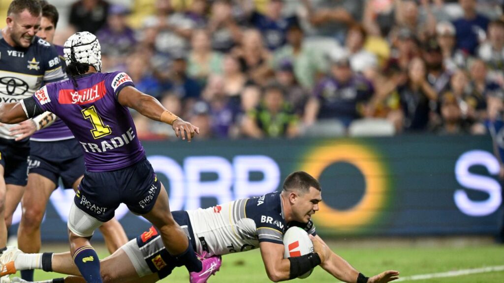 Jake Clifford crosses over for North Queensland who stunned the Melbourne Storm.
