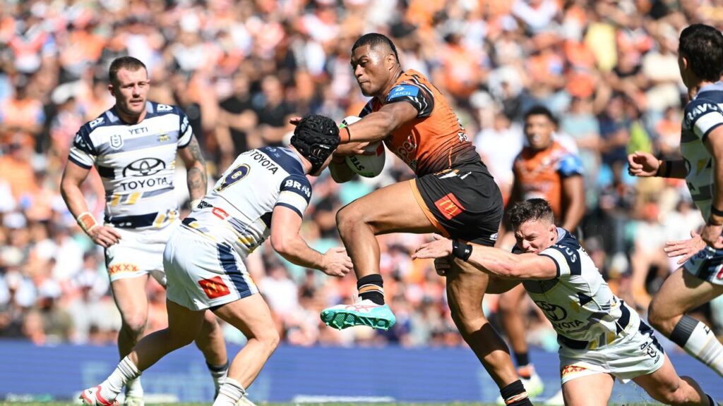 North Queensland hooker Reed Mahoney (No.9) prepares to tackle Wests Tigers’ Samuela Fainu.
