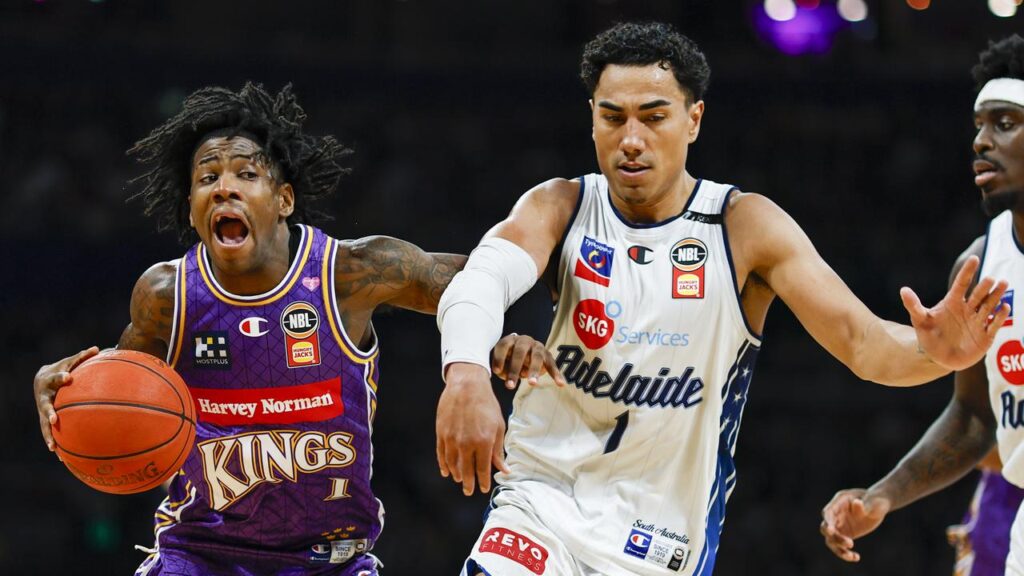 The Kings’ Kendric Davis looks for a way around Adelaide’s Flynn Cameron at Qudos Bank Arena.
