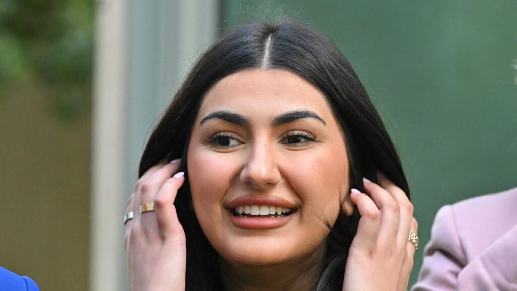 Iranian refugee Ferdos has been waiting 14 years for her visa application to be approved.
