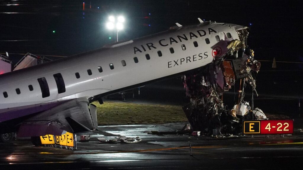 The front of an Air Canada Express flight was destroyed in a collision that left the pilots dead.
