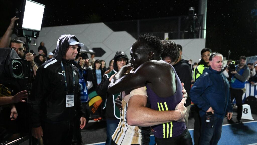 Gout Gout embraces with victor Lachlan Kennedy after their 200m clash at the Maurie Plant Meet.
