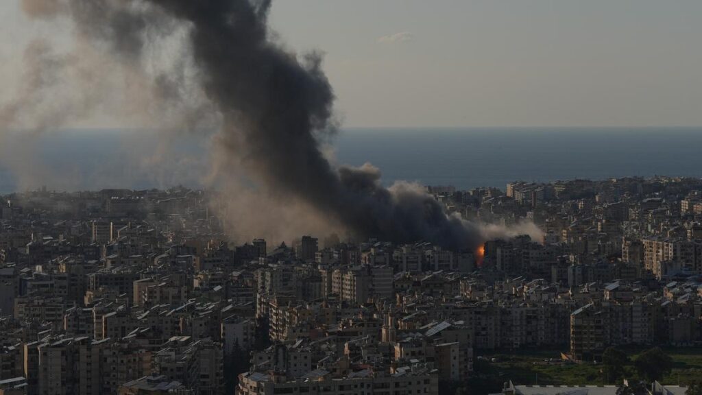 Flames and smoke rise from Israeli airstrikes on Dahiyeh, a southern suburb of Beirut.
