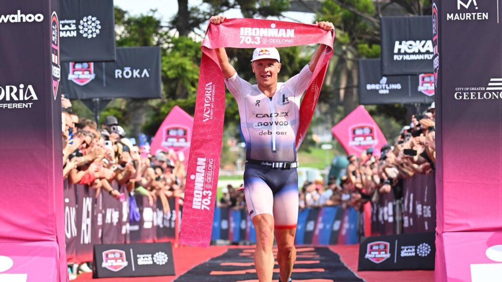 Kristian Blummenfelt crosses the finish line to win the Ironman 70.3 Geelong triathlon.
