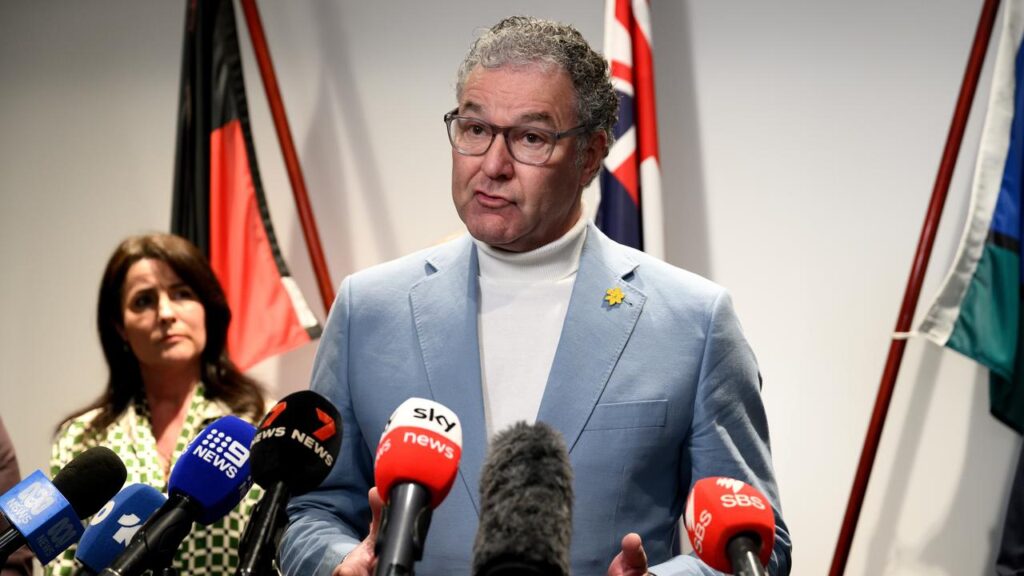 Queensland Arts Minister John-Paul Langbroek accused an author of “glorifying terrorism”.
