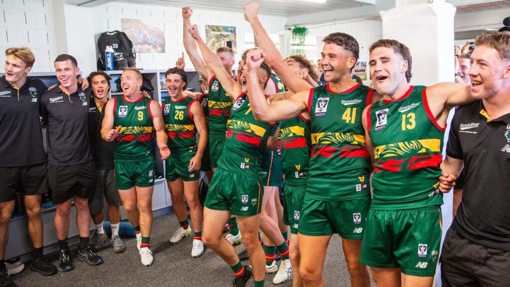 Tasmania Devils players belted out a temporary club song after their historic VFL win over Coburg. 
