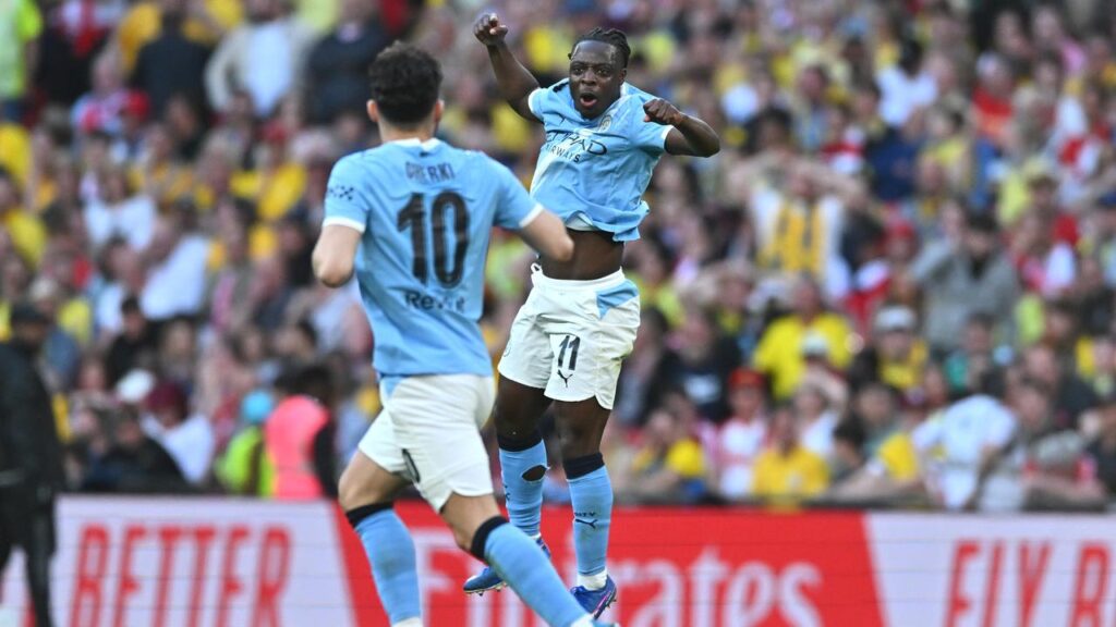 Jeremy Doku leaps for delight after scoring the equaliser in Man City’s FA Cup semi-final win.
