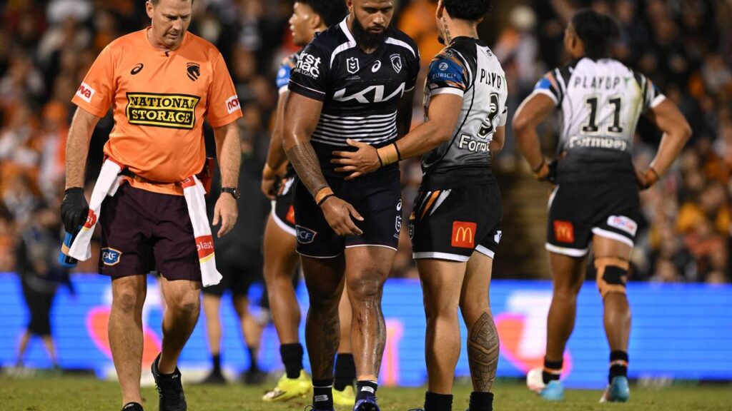 Broncos’ Payne Haas leaves the field after suffering a medial ligament injury against Wests Tigers.
