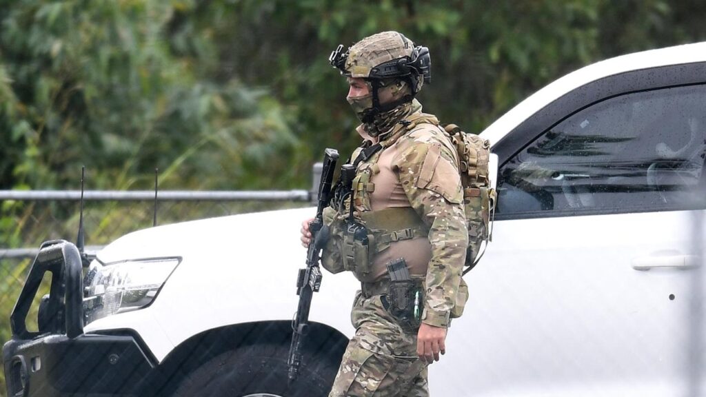 Specialist police were justified in shooting a man who opened fire on them, a coroner has found.
