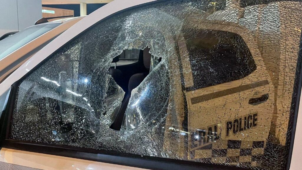 A man will face court after allegedly smashing the windows of a police car on April Fool’s Day.
