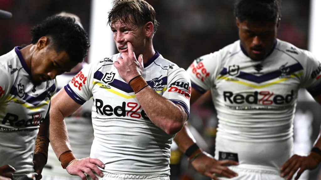 Storm’s Harry Grant (centre) reacts after his side concede a try in the mauling by Panthers. 
