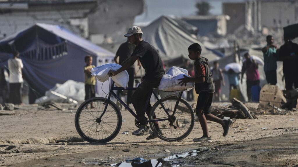 Israeli forces have been accused of shooting a girl dead as Gazan children go to classes in tents. 
