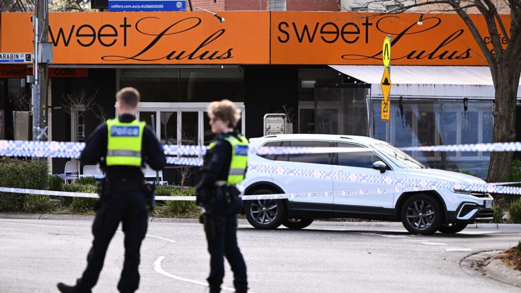 Underworld figure Gavin Preston and another man were shot while sitting outside Sweet Lulus cafe.
