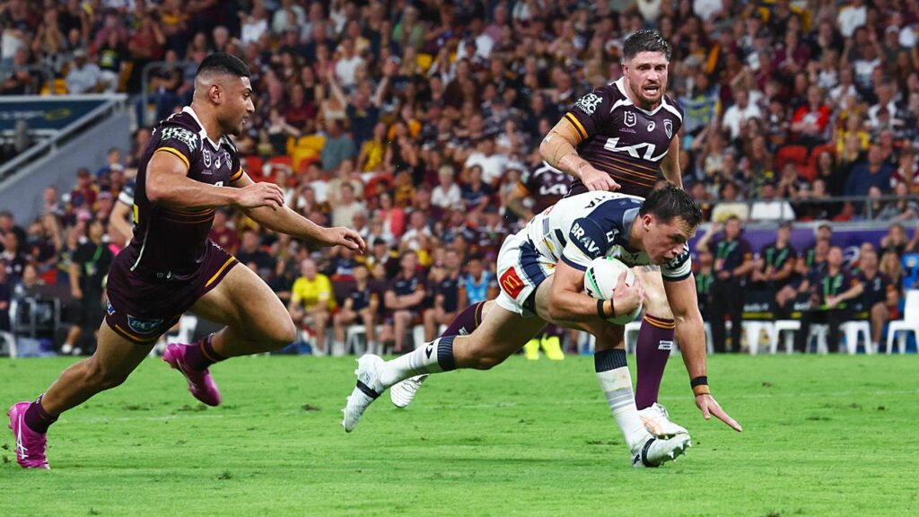 Scott Drinkwater scuttles over for a try in ther Cowboys’ win over the Broncos at Suncorp Stadium.
