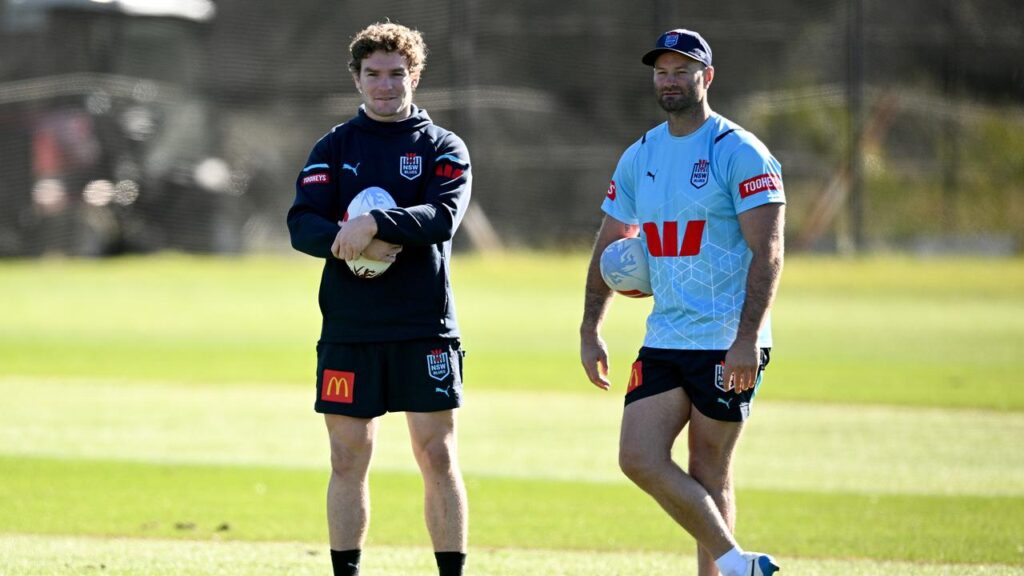Boyd Corndner, watching a 2024 training session with Liam Martin, is the Blues’ new defensive coach.
