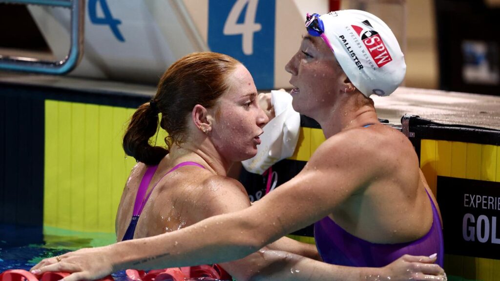 Victorious Mollie O’Callaghan and Lani Pallister embraced after the Australian Open 200m freestyle.
