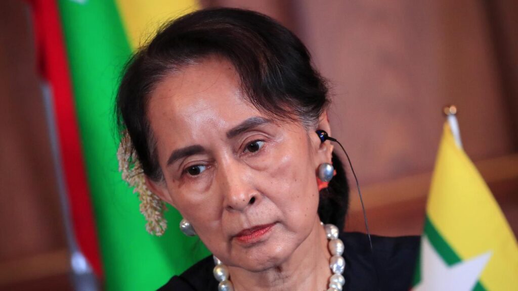 It’s unclear whether Aung San Suu Kyi will be able to serve her reduced sentence under house arrest.
