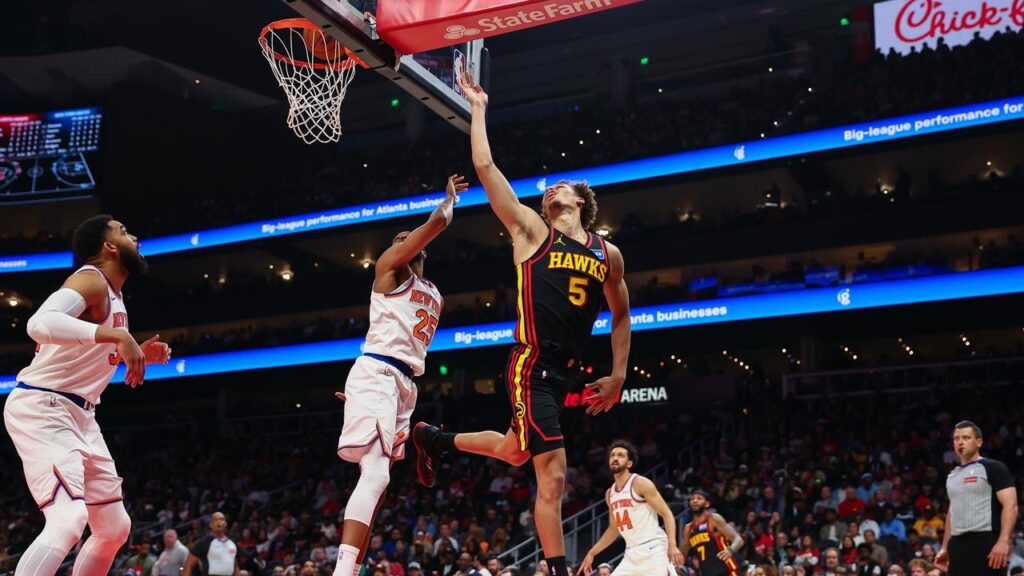 Atlanta Hawks guard Dyson Daniels shoots against New York Knicks centre Karl-Anthony Towns.
