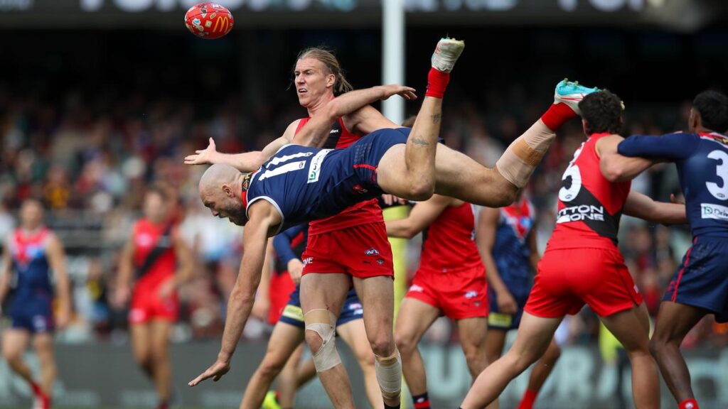 Melbourne captain Max Gawn takes a tumble, like his side did in a Gather Round loss to Essendon.
