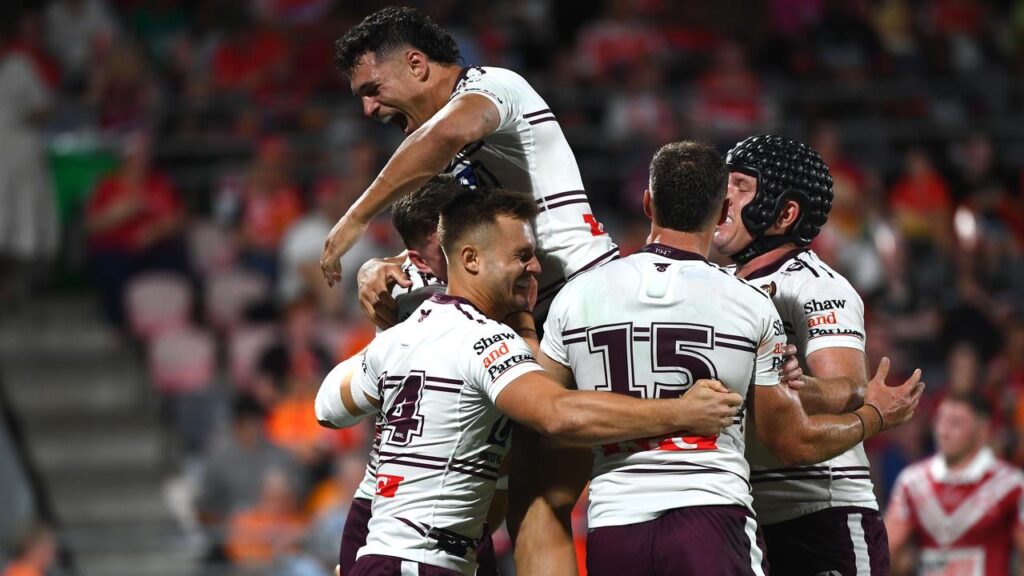 Manly were celebrating as they stunned the Dolphins 52-18 under new coach Kieran Foran.
