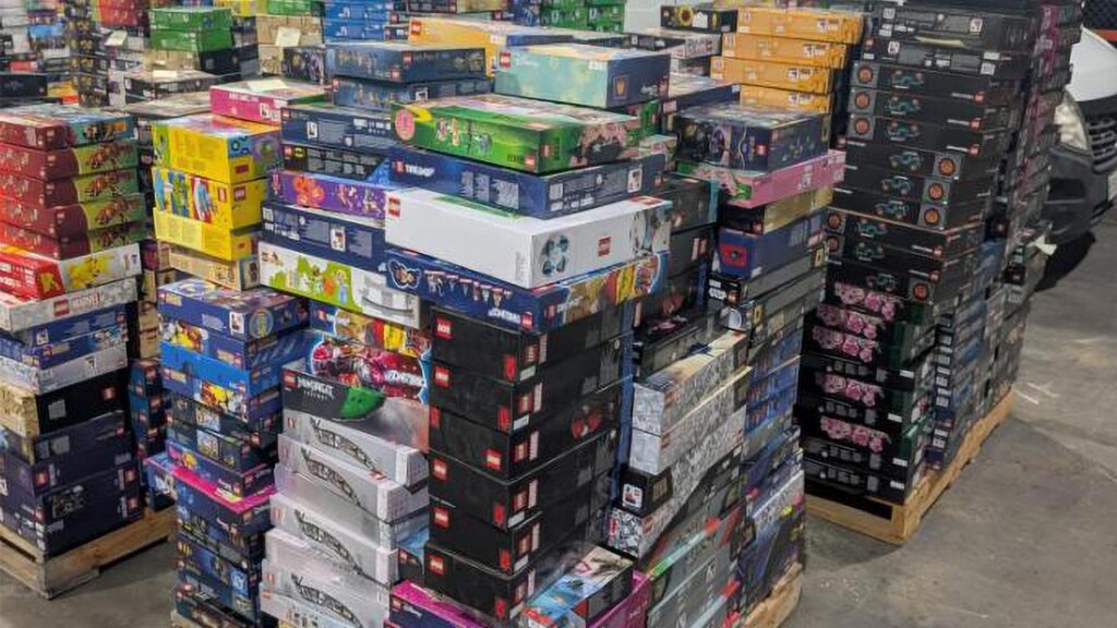 Two people have been charged with theft after police seized $320,000 worth of Lego sets.
