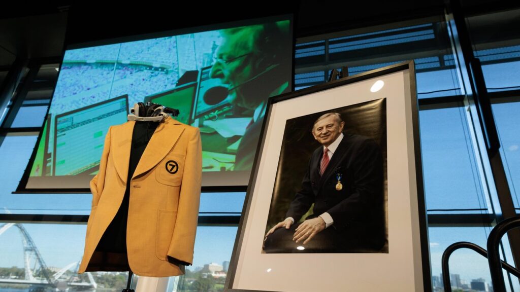 Some of Dennis Cometti’s memorabilia was displayed at the service.

