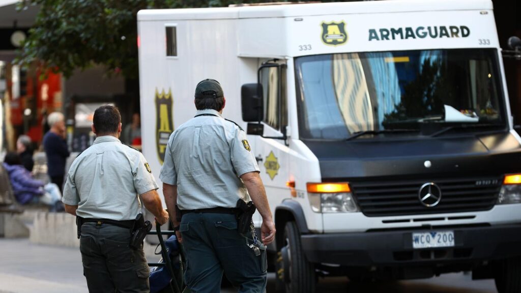 A security guard fired a shot as an Armaguard van was robbed at gunpoint.
