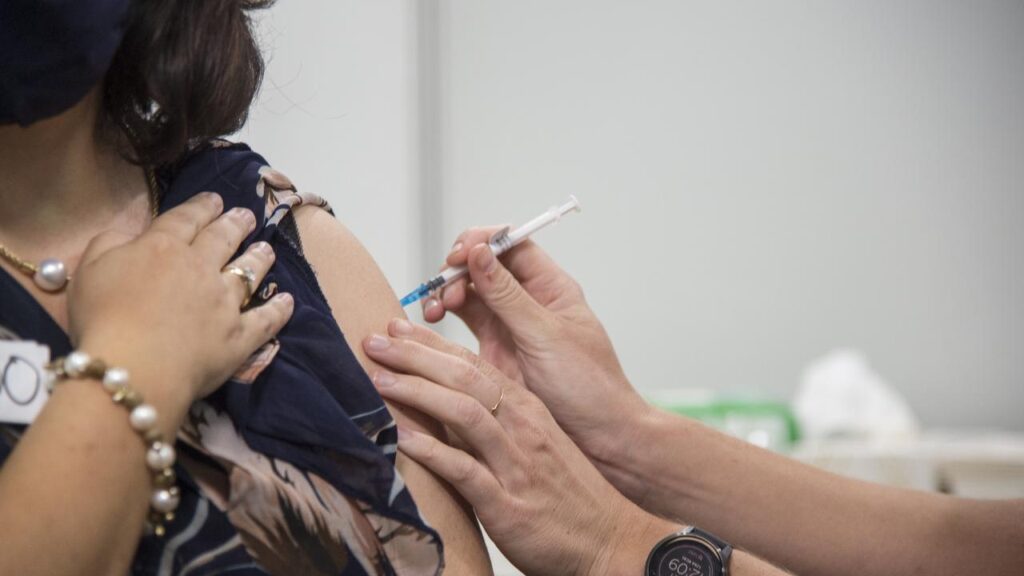 A drop in vaccinations has been blamed for the widespread outbreak of a respiratory disease.
