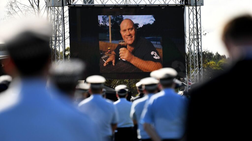 Senior Constable David Masters died after being hit by an allegedly stolen car on the Bruce Highway.
