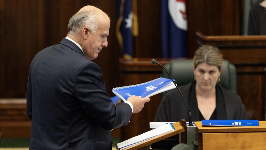 Tasmanian Treasurer Eric Abetz will hand down a state budget tipped to be heavy on reeling in debt.

